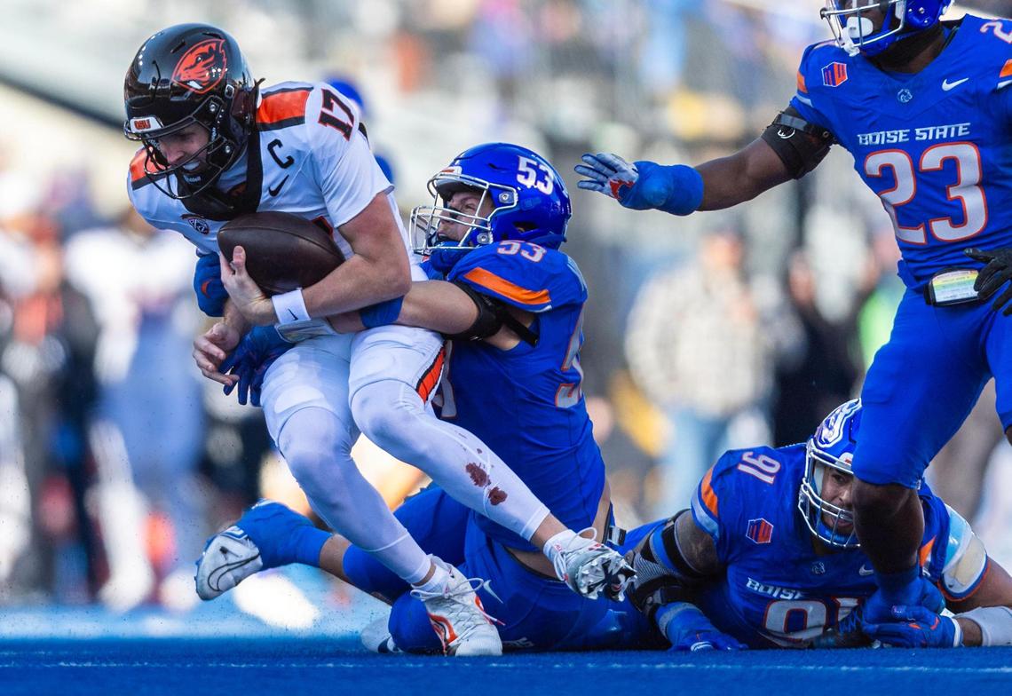 Boise State linebacker Marco Notarainni sacks Oregon State quarterback Ben Gulbranson in 2024.