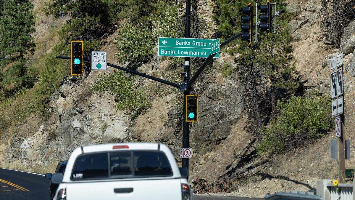 Traffic passes through a new stoplight signal along Idaho's State Highway 55 in Banks, August 15, 2025.