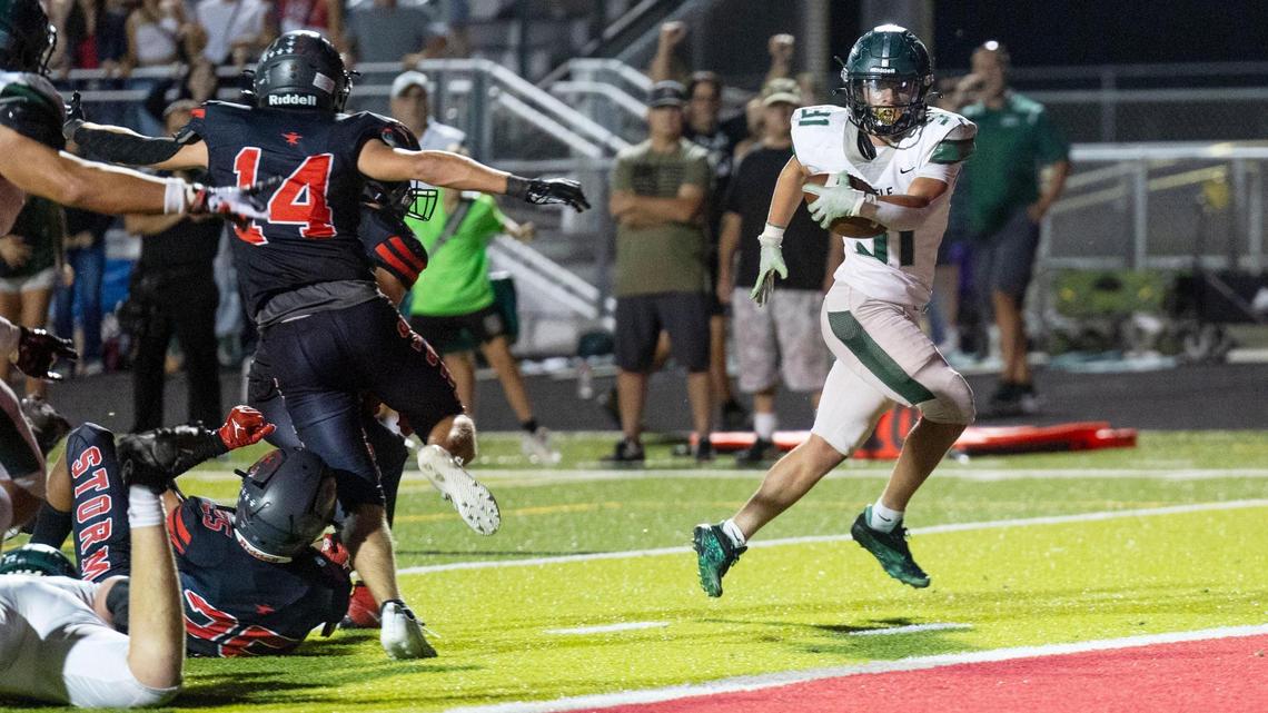 Eagle running back Noah Burnham breaks free for a game-winning 5-yard touchdown run with 58 seconds left Friday at Owyhee. Burnham ran for 114 yards, including 61 on the game-winning drive, in the Mustangs’ 21-17 win.