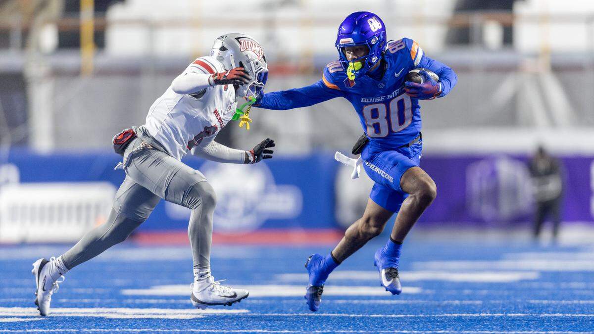 Boise State wide receiver Cam Bates takes off for a first down away from UNLV’s Mumu Bin-Wahad.