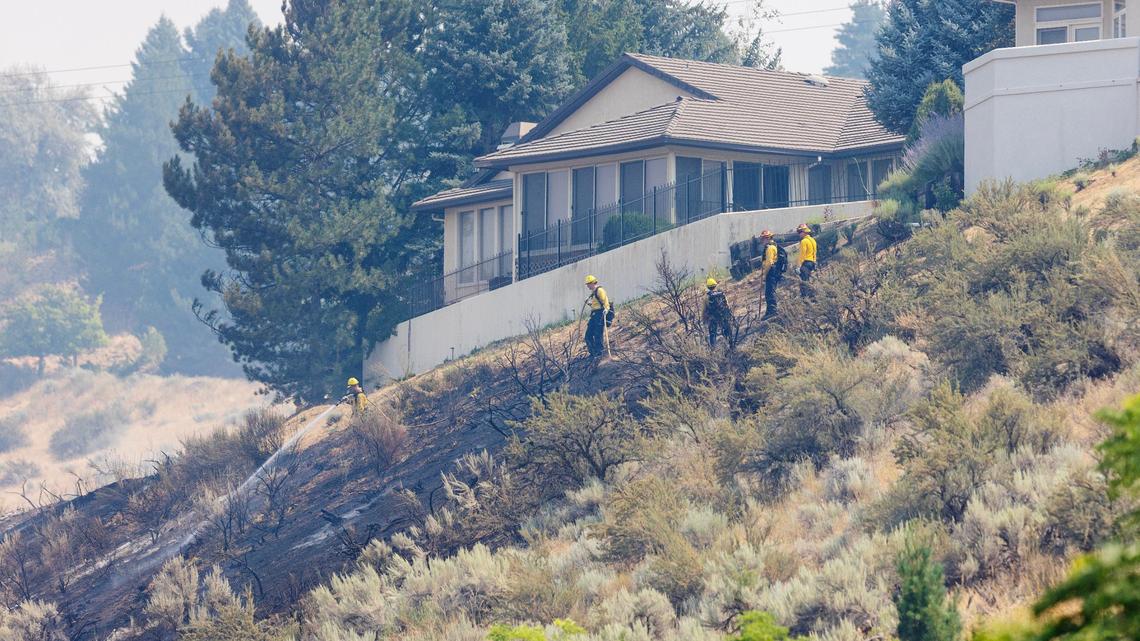 A vegetation fire along Bogus Basin Road on Wednesday afternoon burned close to some homes, but firefighters helped prevent any damage to structures.