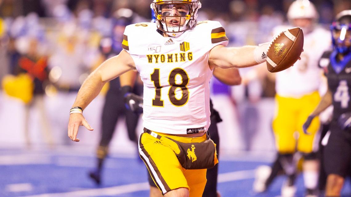 Wyoming quarterback Tyler Vander Waal (18) runs the ball into the end zone on a keeper against Boise State on Nov. 9, 2019. Vander Waal is now at Idaho State.