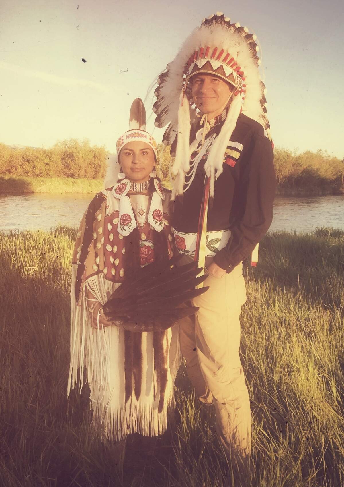 Sammy Matsaw Jr., Shoshone-Bannock, is a fish ecologist from University of Idaho and is working towards a cultural change in academia. Here he wears traditional attire with his wife, Jessica Matsaw.