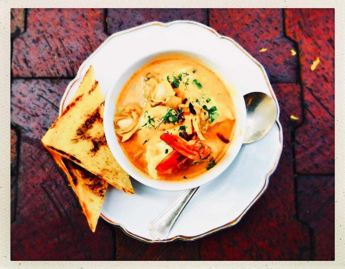 Seafood chowder ($18) includes scallops, shrimp, cod, bacon, leek and potato with grilled bread.