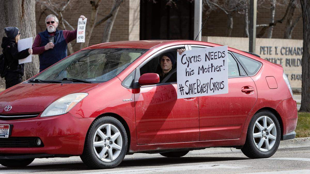 A car repeatedly circles a block in downtown Boise in March, honking its horn in protest of a custody-hearing ruling that relinquished a 10-month-old Meridian child to the state. Some people protested the child’s removal from his parents.