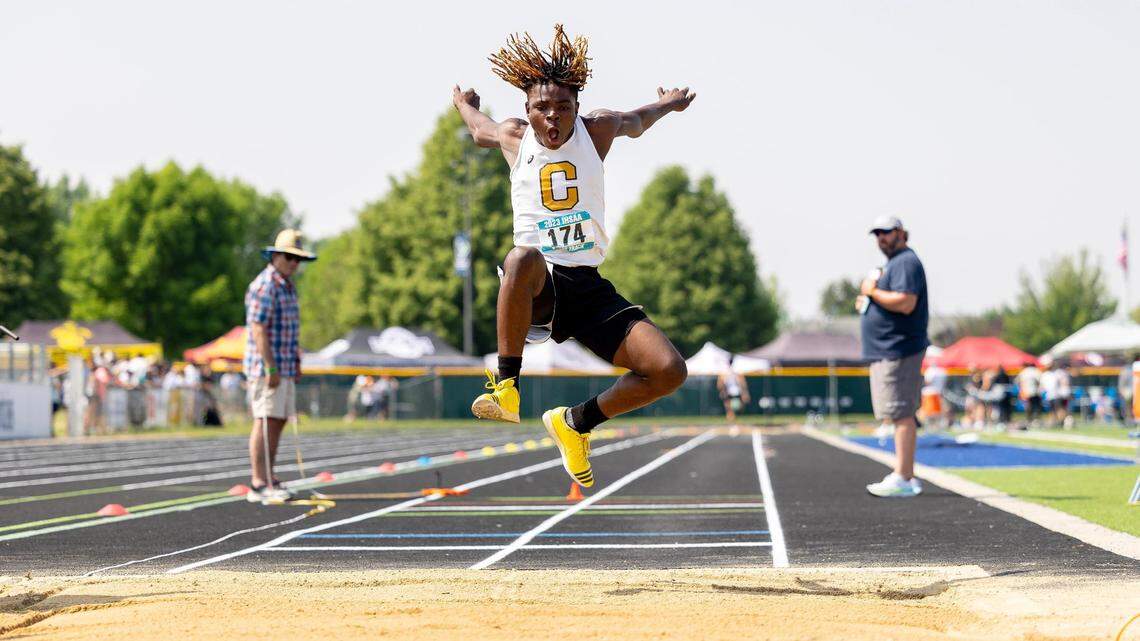 Capital’s Victor Byaundaombe flies toward a landing in the 5A boys triple jump at the state track and field championships Saturday at Mountain View High School.