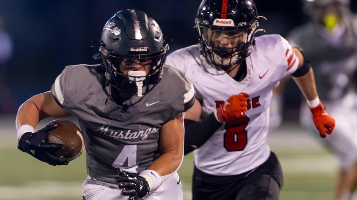 Eagle linebacker Jack Giannini returns an interception for a touchdown last season against Boise. Giannini is one of 15 returning starters for the Mustangs.