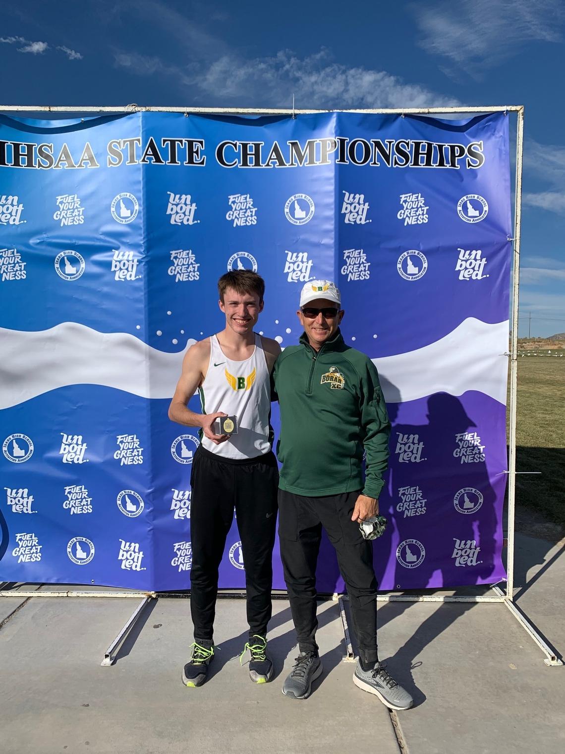 Borah senior Nathan Green, left, won his third straight individual boys cross country title at the 5A meet Friday at Portneuf Wellness Complex in Pocatello. Green is pictured with Borah coach Tim Severa.