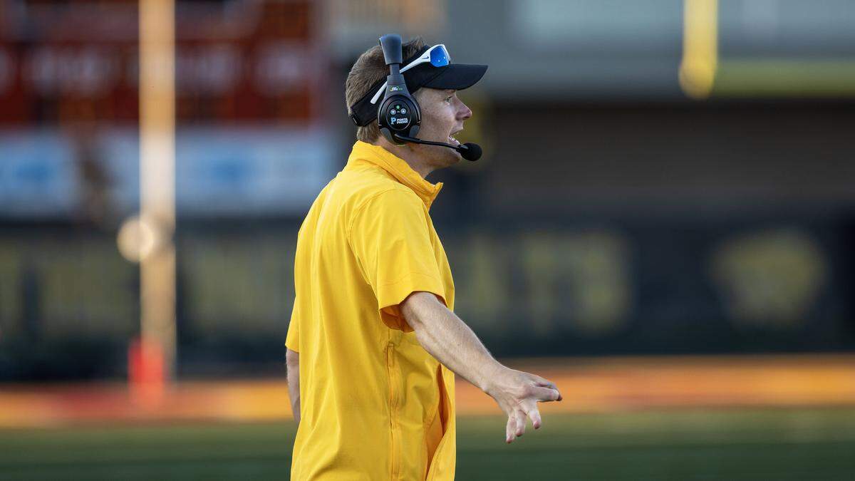Columbia interim head football coach Zechariah Taylor directs his team against Lewiston in the 5A football season opener in Nampa, Friday, Aug. 22, 2025.