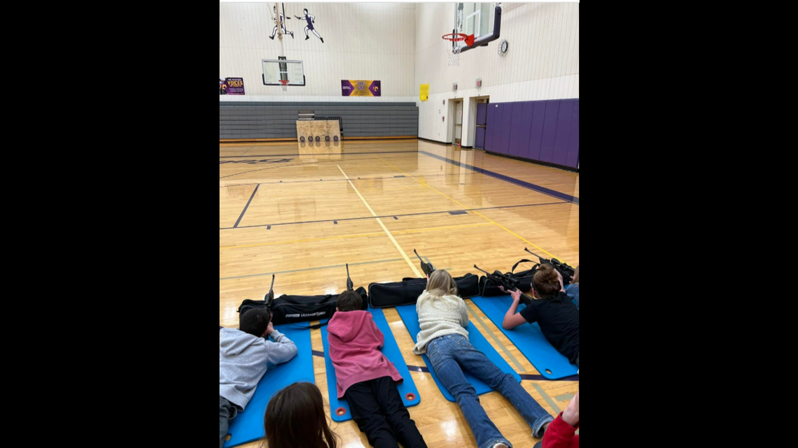 A school district in Wyoming posted pictures of 5th and 6th grade students shooting targets with air rifles in a school gym.