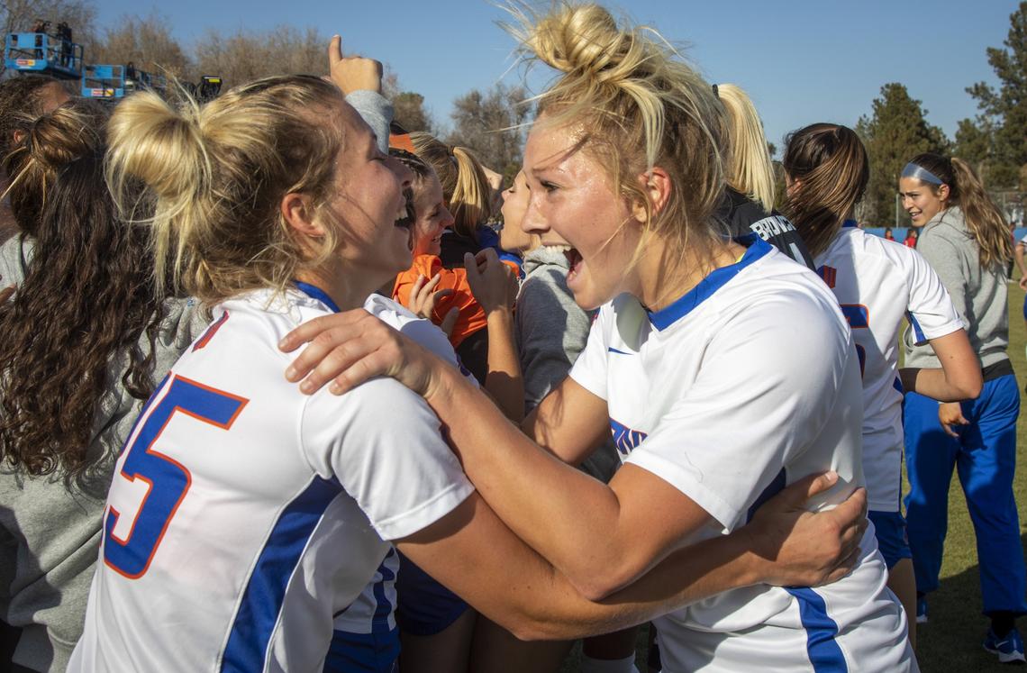 McKenna Kynett, left, and Aubree Chatterton celebrate winning the Mountain West championship.