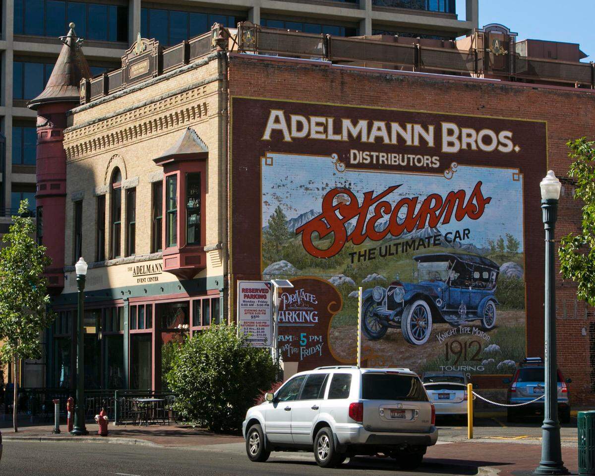 The building has a familiar automobile repair shop mural on it’s brick facade.