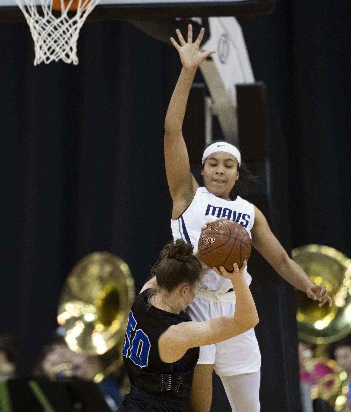 Mountain View freshman rises above Timberline’s Sophie Glancey but fouls her on the play during the state 5A girls basketball semifinals Friday, Feb. 15, 2019 at Ford Idaho Center in Nampa.