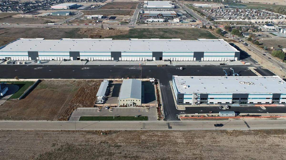This aerial north-facing aerial photo shows the two Sky Ranch buildings with blue trim.