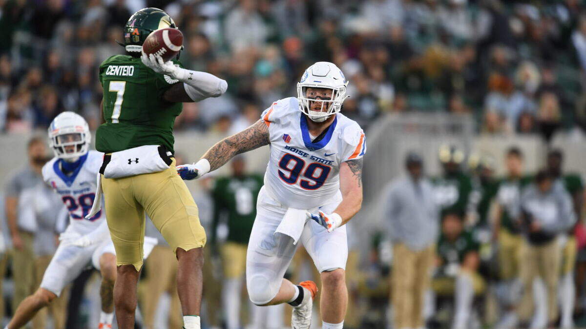 Boise State defensive tackle Scott Matlock puts pressure on former Colorado State quarterback Todd Centeio during the Broncos’ 28-19 win last season in Fort Collins, Colorado.