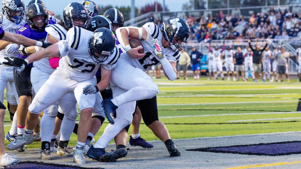 Middleton’s Drew Holman plows through the pile for a touchdown against Rocky Mountain last season. 