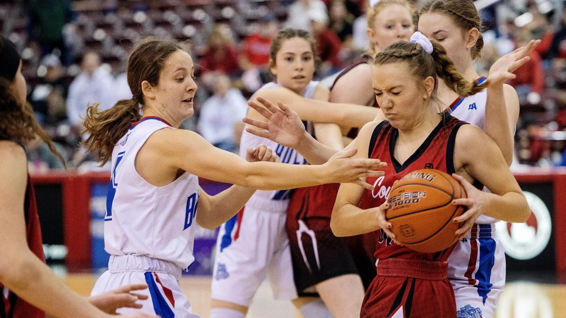 Council sophomore Rhiana Iveson fights to keep possession from Rockland players in the first quarter of the 1A Division II girls basketball state championship game Saturday at the Ford Idaho Center.