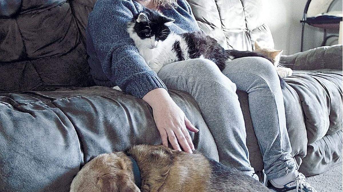 Shawna Ervin cuddles with cats Matthew and Ashley and dog Max. Ervin said the family’s “fur babies” help her unwind at her Nampa home and offer companionship during the day while her children are away at school. Ervin has battled feelings of isolation as an Idahoan with a mental illness. But in the past few months, she started socializing with neighbors and making new friends, as well as venturing out into the job market.
