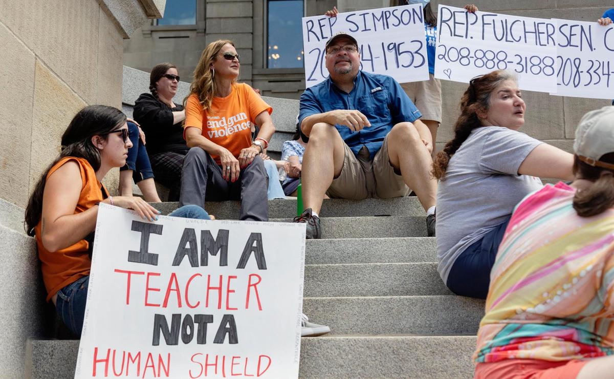 Katelyn Benavidez, a teacher at Jefferson Middle School in Caldwell, holds a sign reading “I am a teacher not a human shield” while attending a March For Our Lives event against gun violence at the Idaho Capitol in Boise on Saturday.
