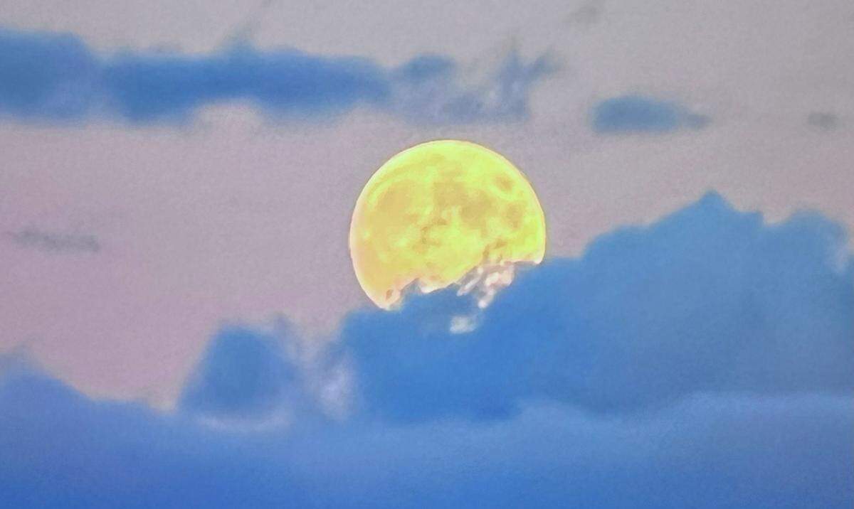 A nearly full pre-Halloween moon rises in the east over Boise at dusk on Friday.