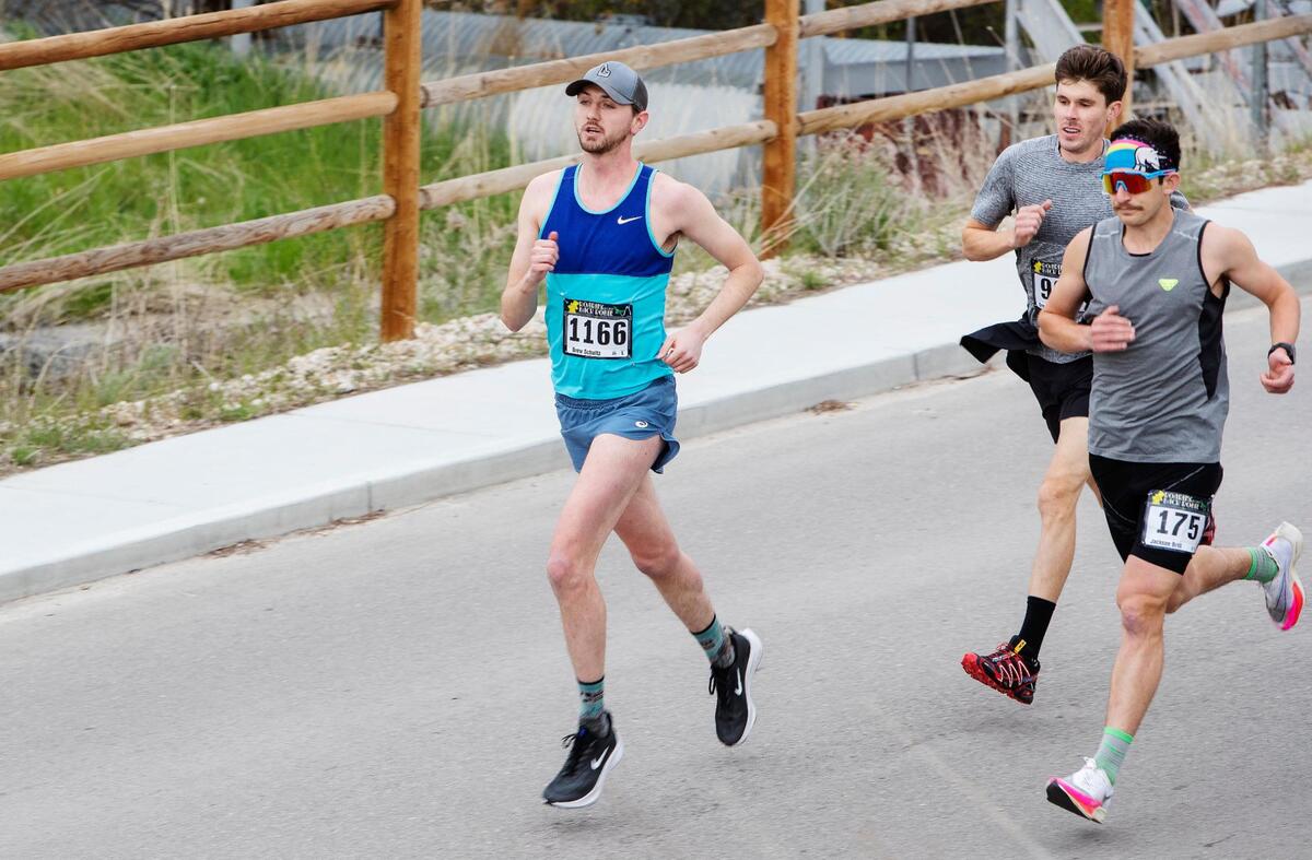 Drew Schultz, left, Greg Montgomery, center, and Jackson Brill, right, race in the lead at the start of the Race to Robie Creek on Saturday. Brill won first place, Montgomery placed second and Schultz took third.