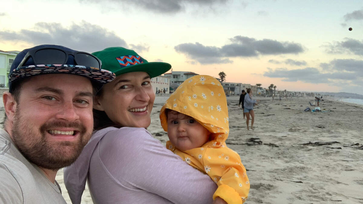 Mitch is shown with his wife and child.