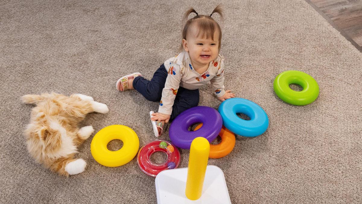 Ryan and Aubrey Nobili’s daughter Vivi, 1, plays in the living room of their Nampa home.