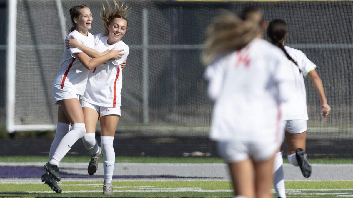 Owyhee forward Alexa Zierenberg celebrates a goal with teammate Lilli Denardt late in the second period against Mountain View in the 6A girl's soccer state tournament at Rocky Mountain High School in Meridian, Thursday, Oct. 23, 2025.