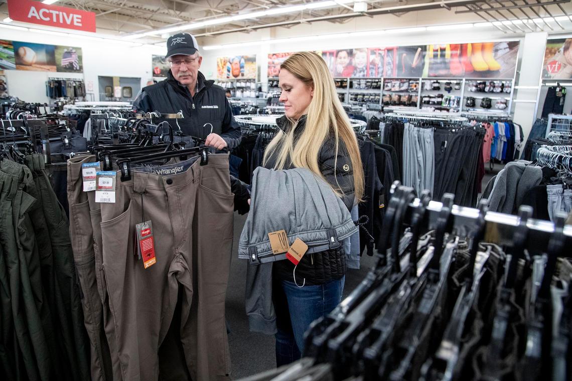 Heidi and Jeff Burns from Terreton in Eastern Idaho shop for pants Saturday, Jan. 11, at VF Outlet, one of the larger stores at Boise Outlets.