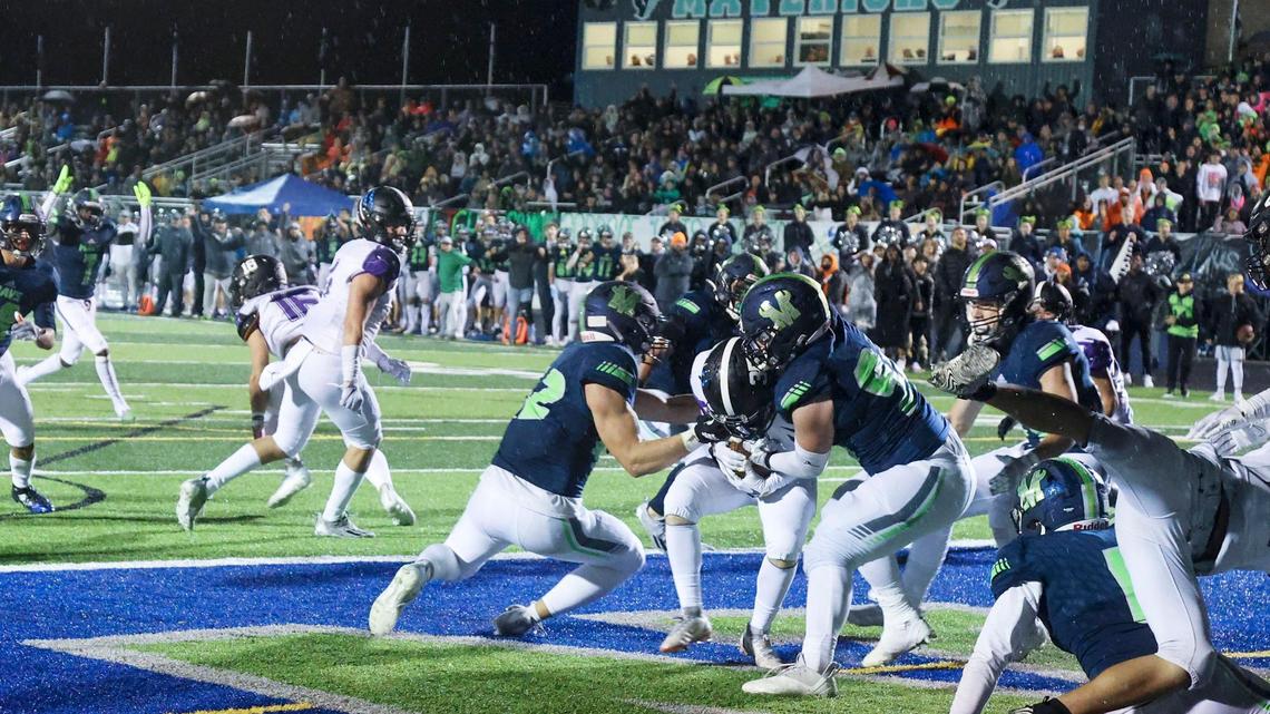 Mountain View jumps on Rocky Mountain punter Dawson Anderson for a safety Oct. 22 in the 5A SIC championship game. The win capped a perfect regular season and earned the Mavericks the No. 1 ranking in 5A.