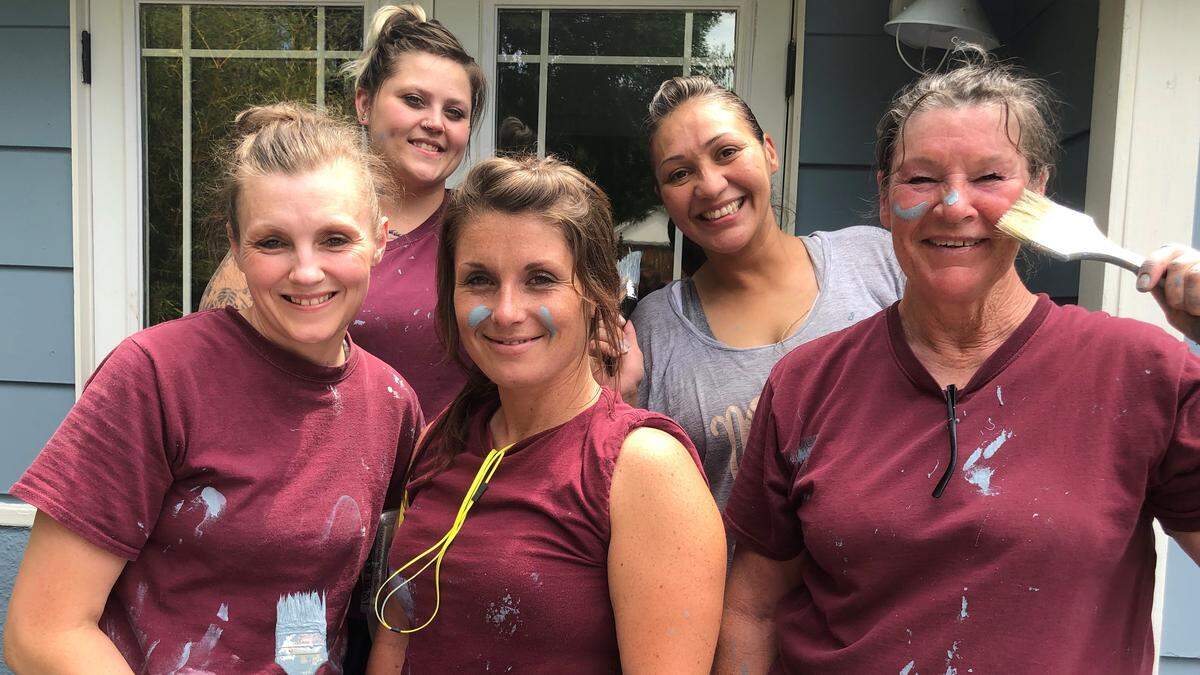 Women offenders Brittany Ward, Tawny Maki, Cassie Yoakum, Amanda Diaz or Donna Vaughn take part as volunteers in Paint the Town in Boise in June.