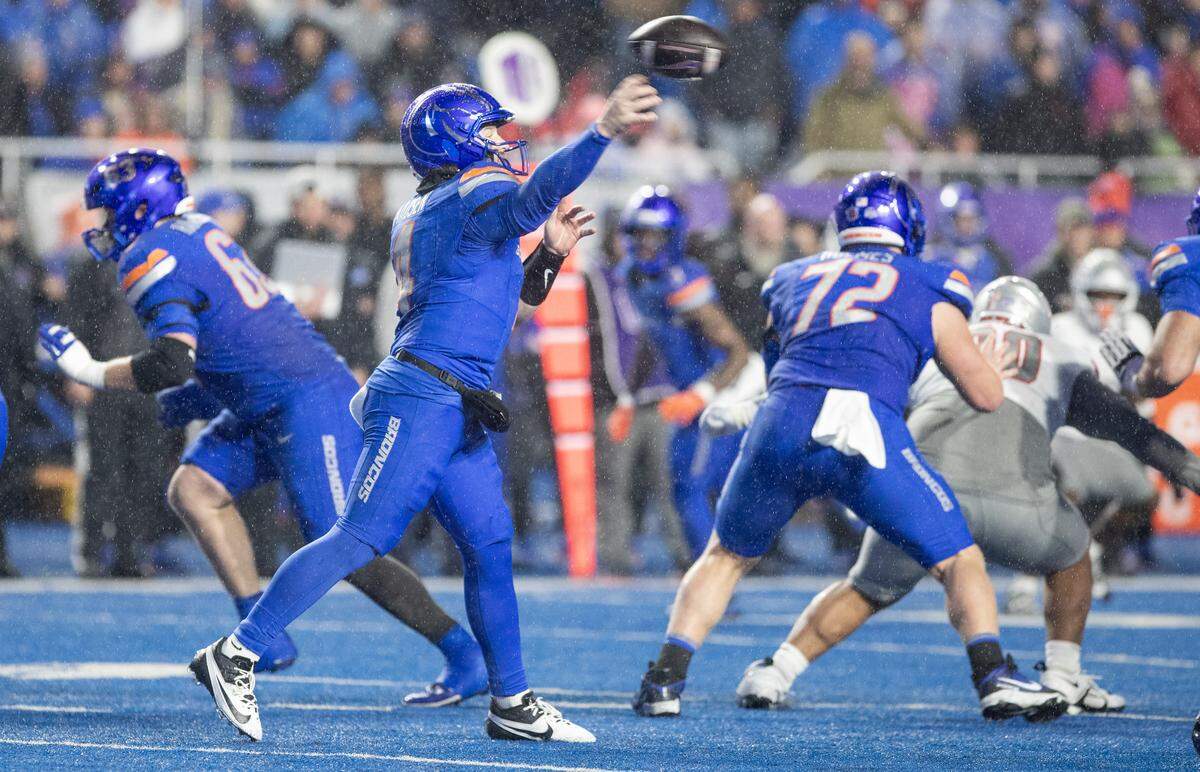 Boise State quarterback Maddux Madsen throws a second-half pass when the rain returned against UNLV at Albertsons Stadium on Friday night.