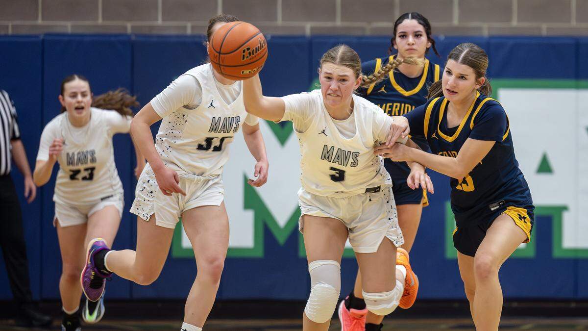 Mountain View senior Addie Lee gains control of a loose ball during their 6A District Three girls basketball tournament play-in game against Meridian, Tuesday, Feb. 3, 2026.