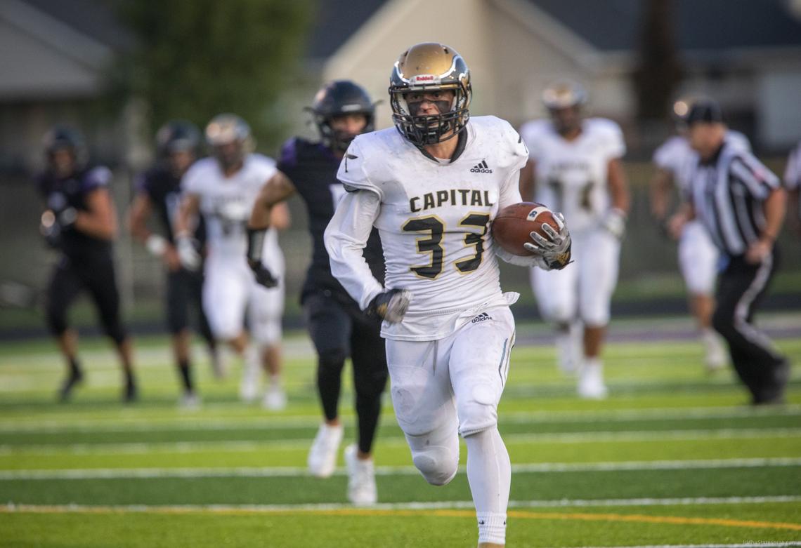 Capital’s Jackson Reed scores on an 88-yard touchdown pass last season against Rocky Mountain.
