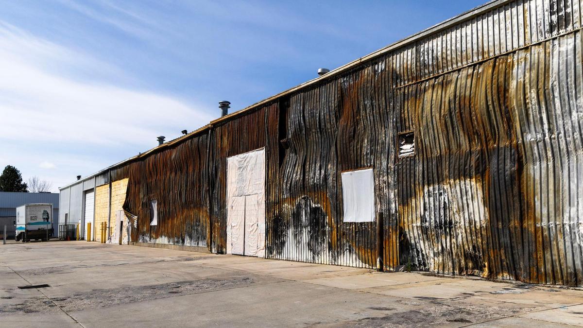 Scars from the 2022 fire can still be seen on the eastern side of the outlet store, which is planning to reopen on Thursday.