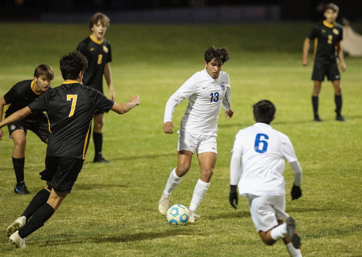Caldwell forward Jaden Pineda dribbles the ball in the first half of their game against Bishop Kelly on Thursday in Middleton.