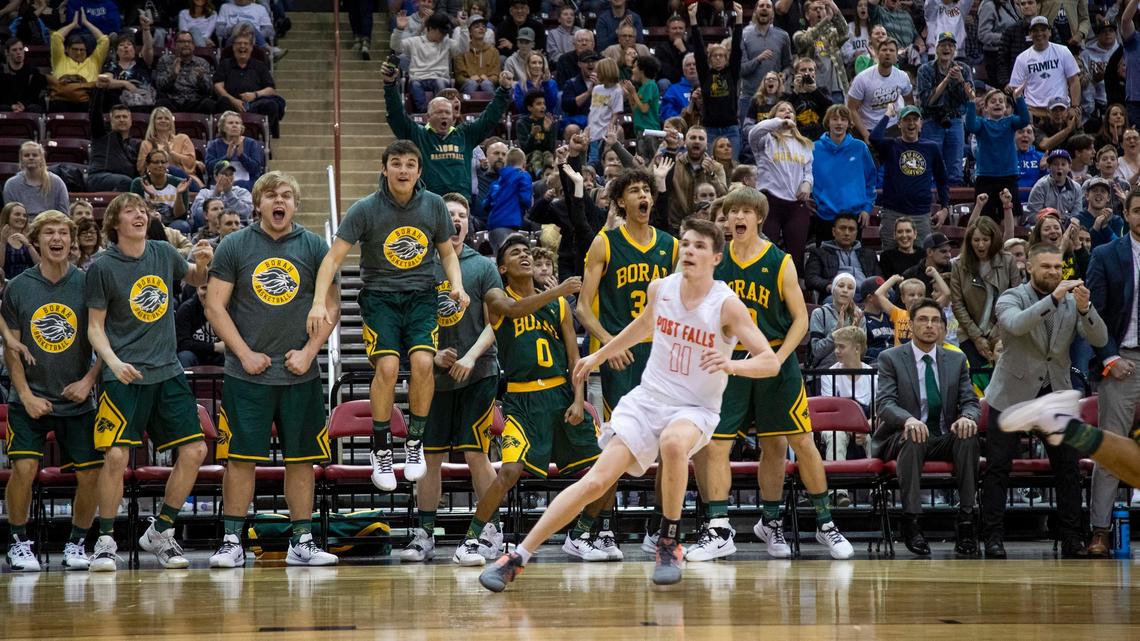 Borah’s bench and fans explode after a dunk by teammate Isaac Dewberry Post Falls in the 5A state boy’s basketball championship Saturday, March 7, 2020 at Ford Idaho Center in Nampa.
