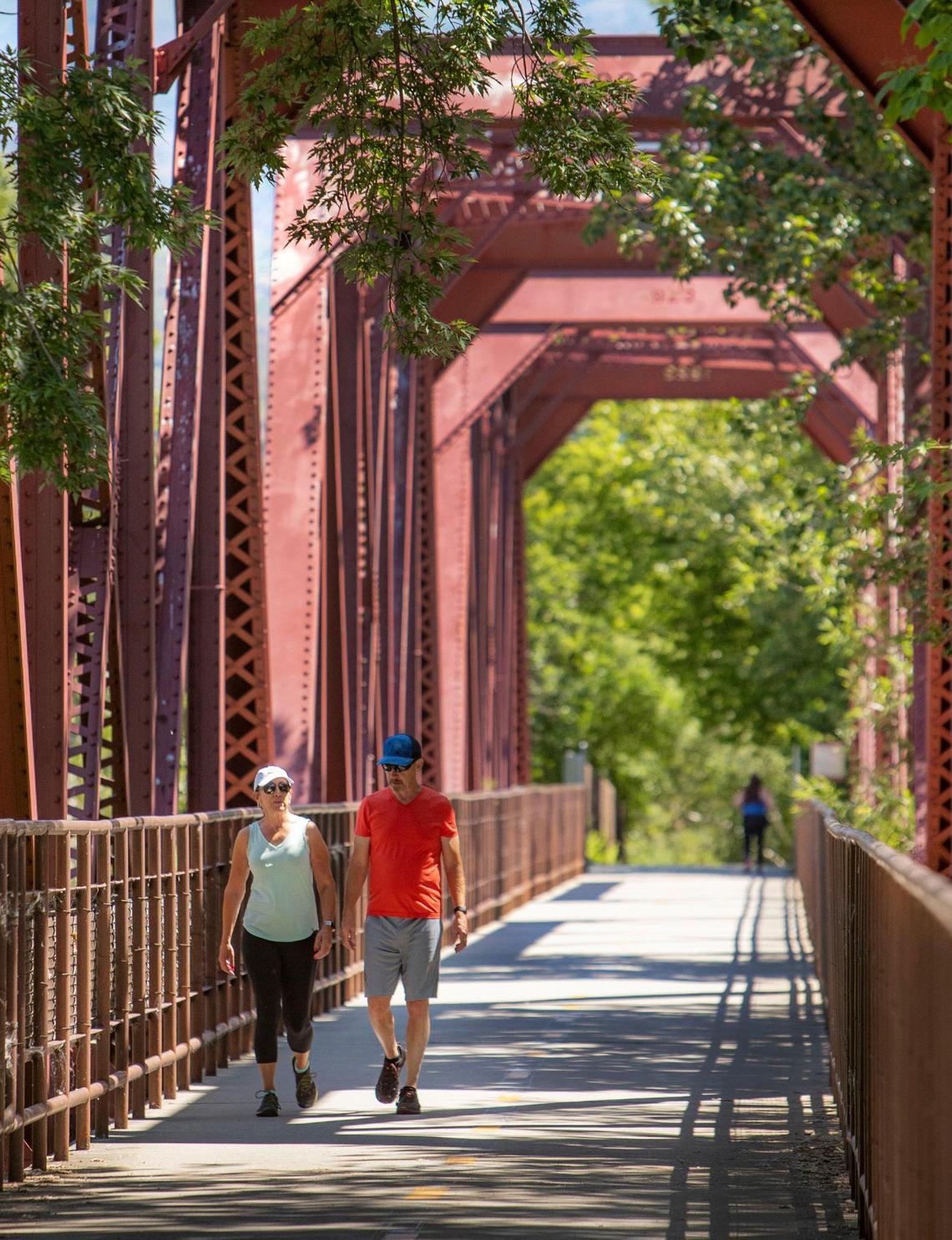 Sherry and Ken Fernandez relax with a walk along the Railroad Trestle Bridge built in 1928. The Boise River Greenbelt on the river’s north side will be replaced this summer from this bridge east to the 9th Street Bridge downtown.