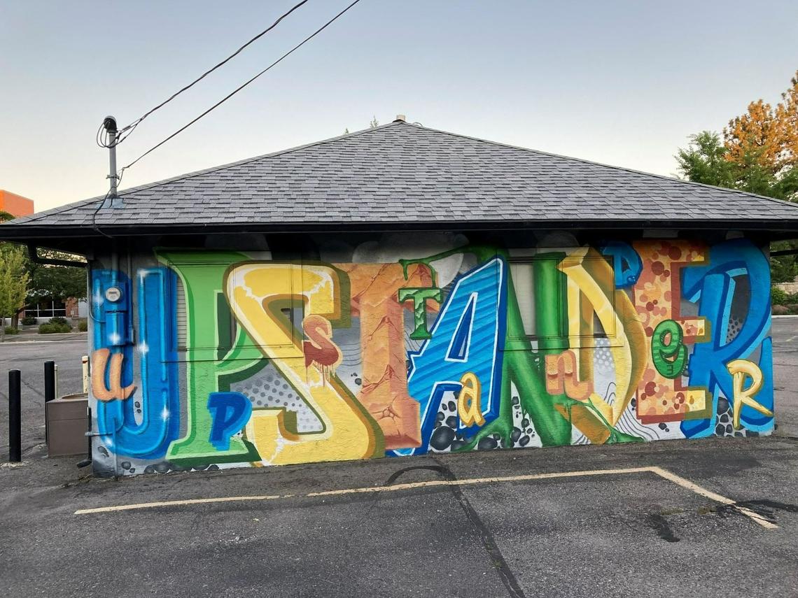 The former Wassmuth Center for Human Rights building at 777 S. 8th St. in Boise in July 2022. Why did the mural say Upstander? “Bystanders are those who witness injustice and do or say nothing,” the center says on its website. “Doing or saying nothing sends a message that injustice is acceptable. It isn’t! Be an Upstander.” The building was later torn down to make way for a new education center and parking.