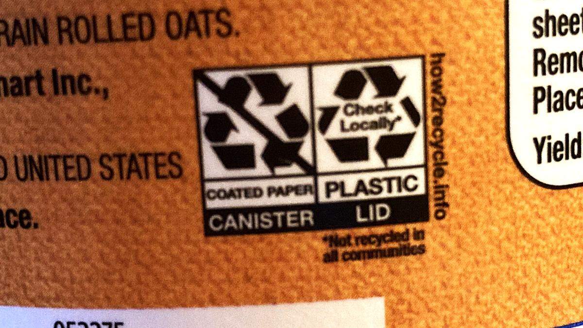 Some cardboard food containers, like this canister of Walmart oatmeal, contain recycling instructions and a link to how2recycle.info. This label says the box is coated paper and must be trashed. It says the plastic lid is recyclable but to check locally. The lid on this box was labeled No. 2 plastic, which is recyclable in Boise’s and many other recycling programs in the United States.