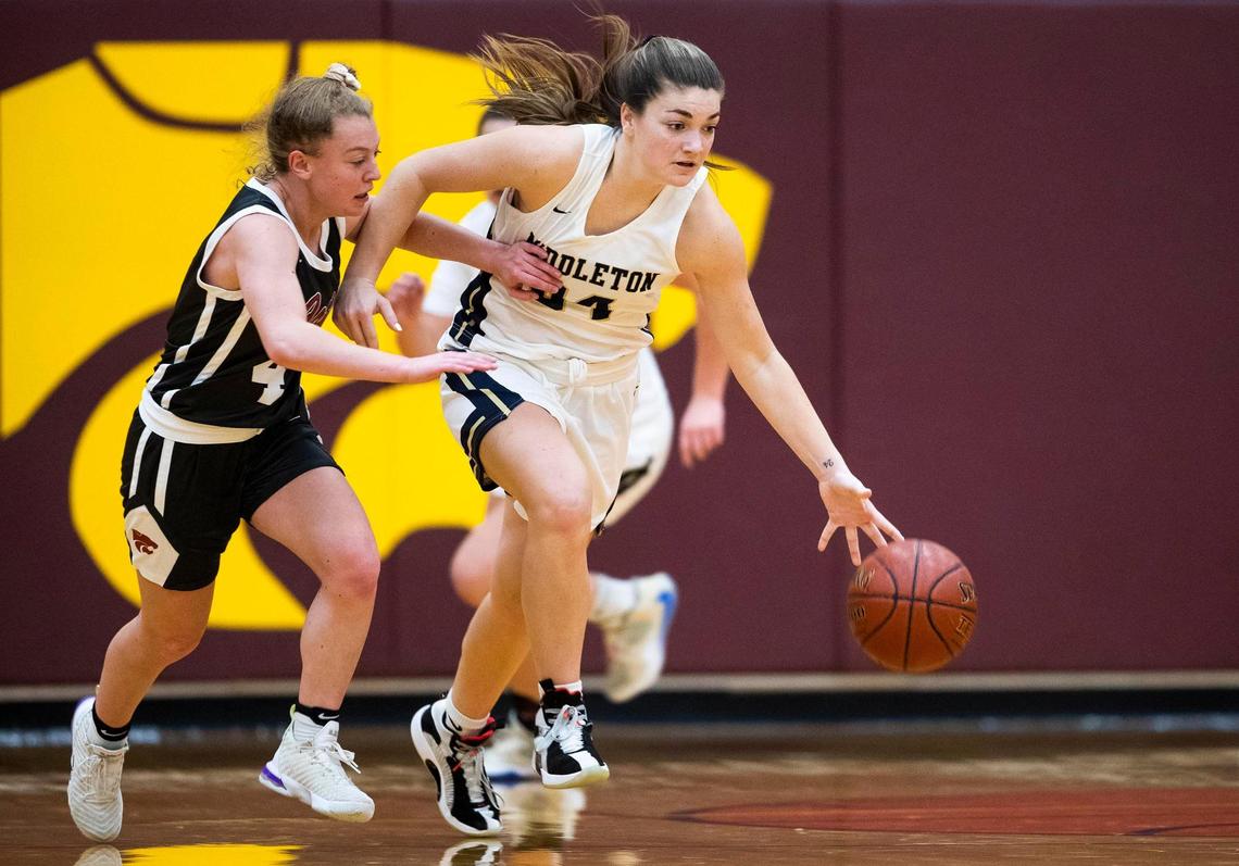 Middelton guard Payton Hymas starts a fast break after stealing a pass intended for Columbia guard Kaylee Fone in the 4A District Three girls basketball championship Thursday at Columbia High School in Nampa.