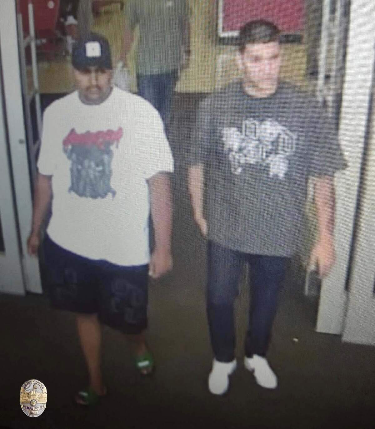 Security camera footage shows two men who are suspects in the theft of an elderly woman’s purse on Sunday afternoon.