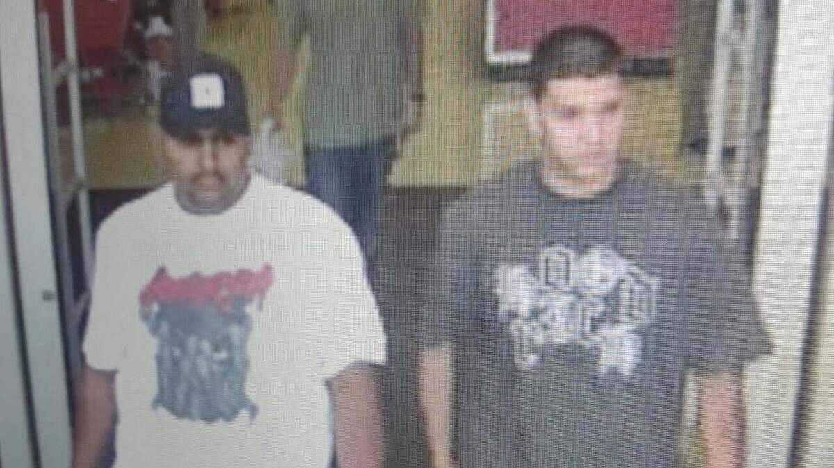 Security camera footage shows two men who are suspects in the theft of an elderly woman’s purse on Sunday afternoon.