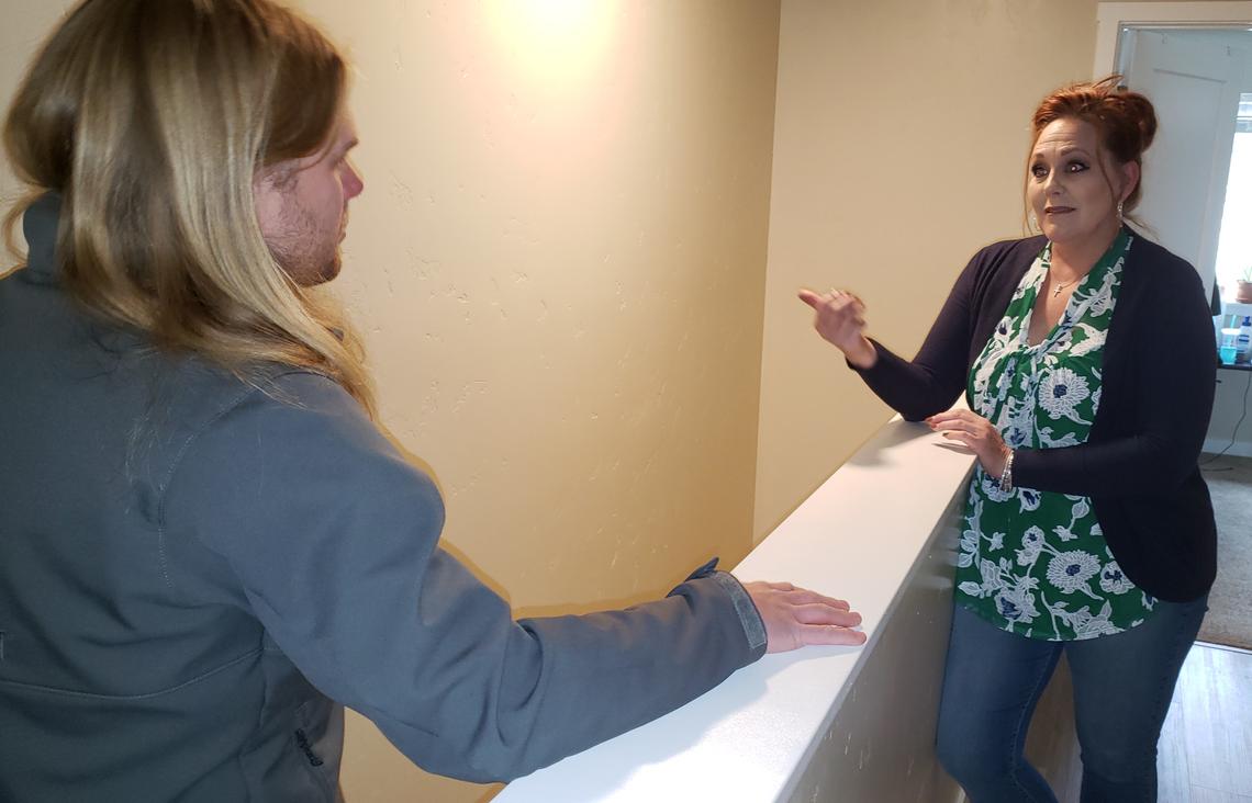 Property manager Sue Dominiak tells Erik Berg, president of the SouthEast Neighborhood Association, that it’s appropriate to have high-density housing within walking distance of Boise State University. They’re speaking inside a duplex with 10 bedrooms two blocks south of campus. “Now if there was enough housing on campus, you could take some of those students out of a rental like this,” Dominiak said.