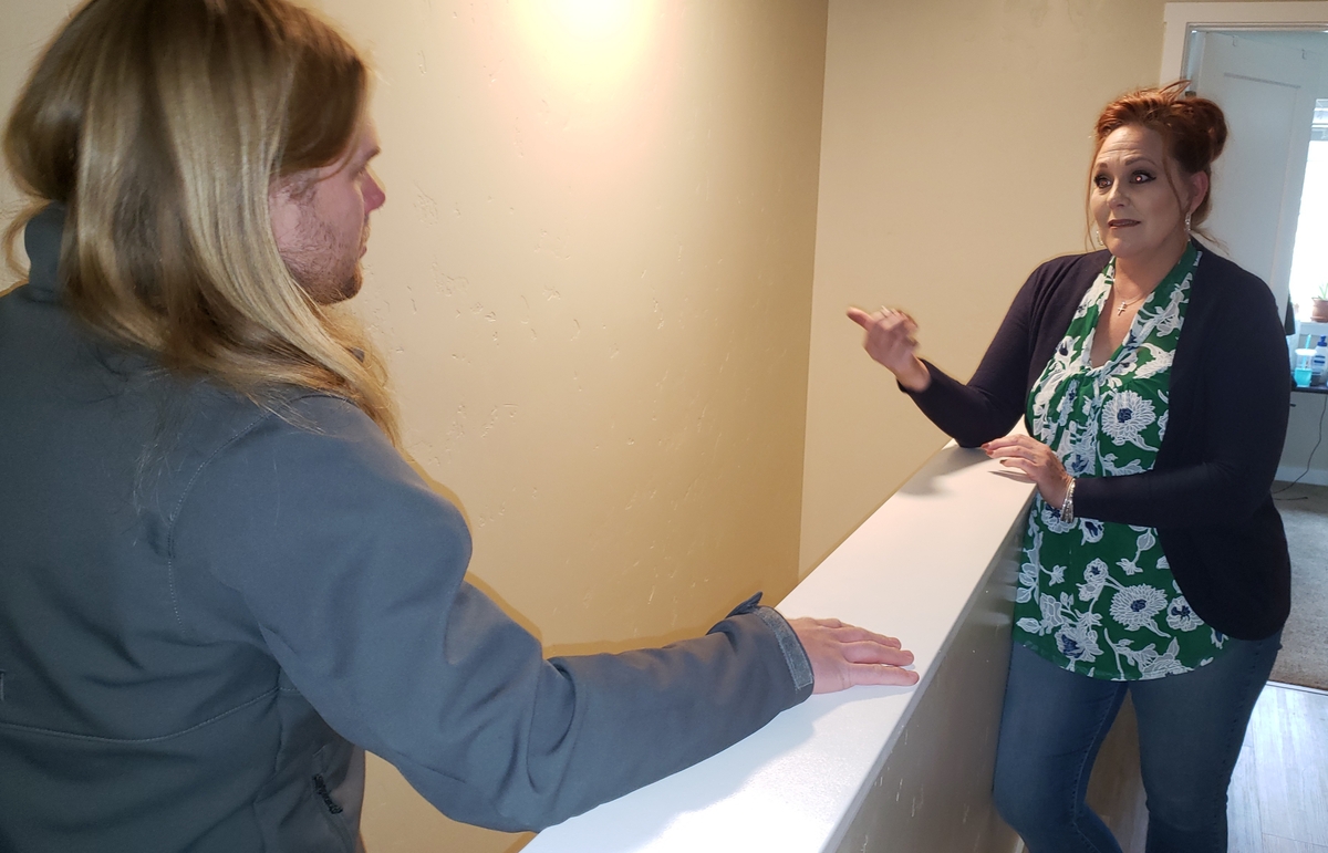 Property manager Sue Dominiak tells Erik Berg, president of the SouthEast Neighborhood Association, that it’s appropriate to have high-density housing within walking distance of Boise State University. They’re speaking inside a duplex with 10 bedrooms two blocks south of campus. “Now if there was enough housing on campus, you could take some of those students out of a rental like this,” Dominiak said.