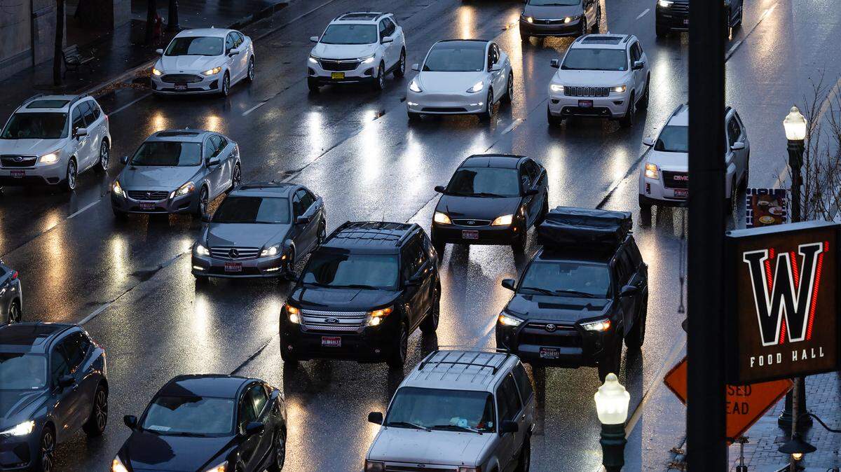 Rain falls on Front Street as vehicles fill the lanes heading west past 8th Street last year in downtown Boise.