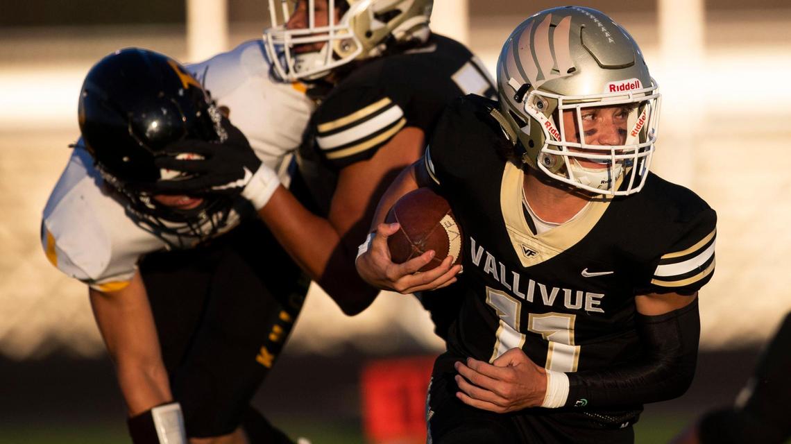 Vallivue quarterback Isaac Moore, right, returns to lead a new offense after an offseason coaching change.