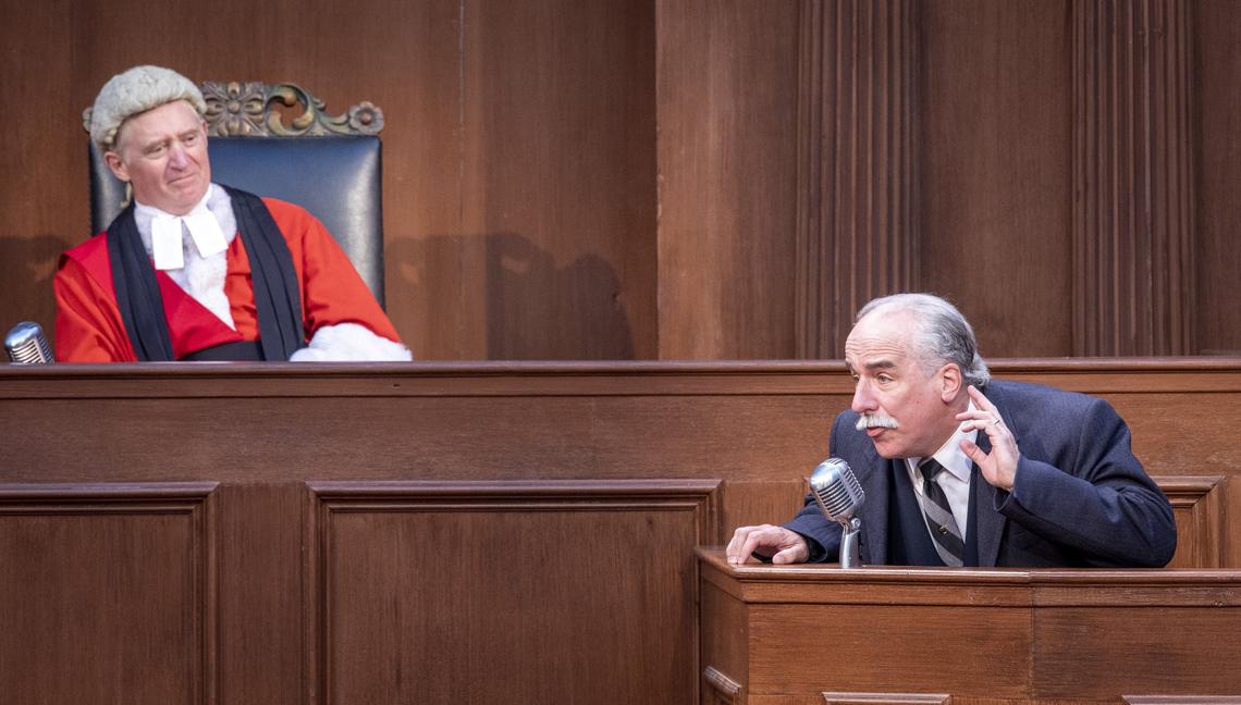 Dr. Wyatt (M.A. Taylor), who was called to the scene of the murder, testifies in the court of Mr. Justice Wainwright (David Anthony Smith) in the Idaho Shakespeare Festival performance of Agatha Christie’s “Witness for the Prosecution.”