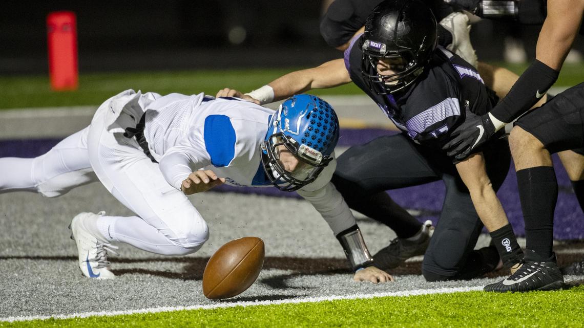 Timberline quarterback Andy Peters and Rocky Mountain linebacker Jacob Loveland scramble for a loose ball in the Timberline end zone in the 5A state quarterfinals Friday. But the play was ruled dead with forward progress at the 1-yard line.