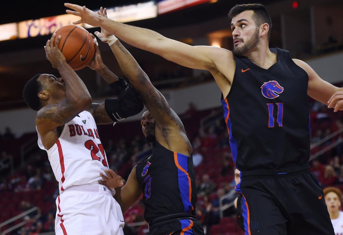 Fresno State guard Deshon Taylor runs into Boise State’s Zach Haney, right, in the first half of the Bulldogs’ 65-63 victory over the Broncos Wednesday night, Feb. 13, 2019 in Fresno.